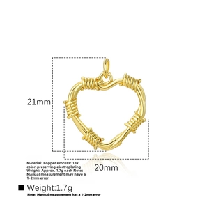 Detailed macro view of heart-shaped hollow pendant with wire-wrapped texture in 18k gold plating