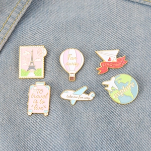 Set of 6 travel-themed enamel pins featuring hot air balloon, airplane, and globe designs