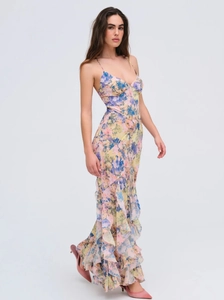 Close-up of sweet floral long dress featuring ruffle hem and spaghetti straps details