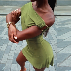 Detail of off-shoulder olive green bodycon dress with metal ring and knitted texture
