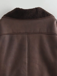 Detail of dark brown faux suede texture and faux shearling collar on a biker jacket