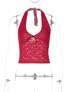 Detailed close-up of red floral lace halter top with deep V-neck and bow tie detail