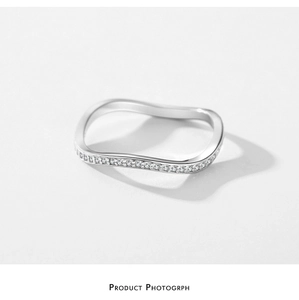 Detailed view of S925 sterling silver wavy ring with micro-pave cubic zirconia