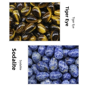 Polished tiger eye and blue dot jade egg-shaped stones showing natural mineral textures