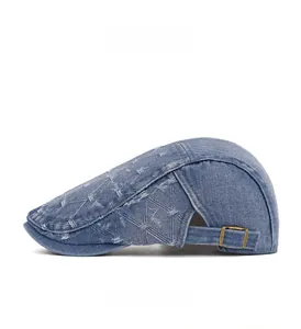 Side view of washed denim newsboy cap featuring jacquard diamond texture and metal buckle