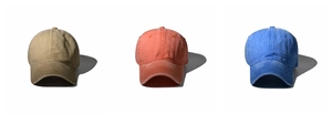 Detailed trio of washed cotton baseball caps in khaki, orange, and royal blue colors