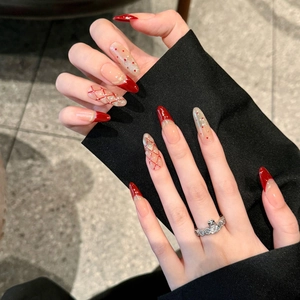 Red plaid and glitter cat-eye press-on nails in medium-long stiletto shape for women