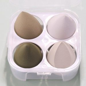 Macro view of 4-piece makeup sponge set with diverse shapes in a transparent storage box