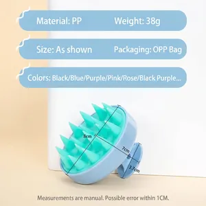 Ergonomic blue scalp massage brush with green silicone bristles weighing 38g for hair washing
