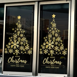Golden snowflake Christmas tree static window sticker on a store glass door