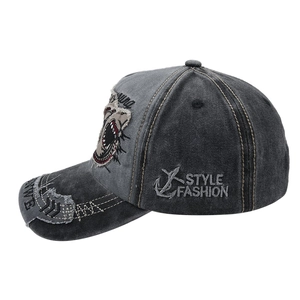 Detail of vintage washed baseball cap with shark patch and anchor embroidery