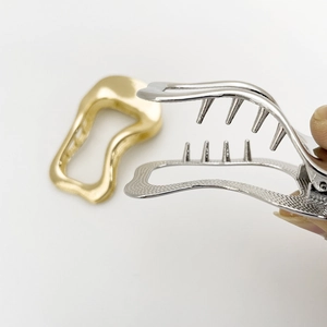 Irregular wave-shaped alloy hair clips in gold and silver finish for sleek hair styling