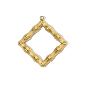 Close-up of golden rhombus pendant with bamboo texture finish on white background