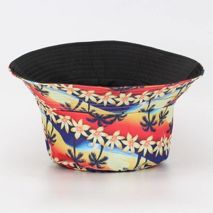 Detail of tropical palm leaf and floral print pattern on a summer sun bucket hat