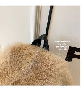 Close-up of khaki faux fox fur backpack showing plush texture and durable black handle