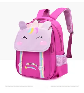 Detail view of pink unicorn school backpack with 3D embossed horn and mesh side pocket