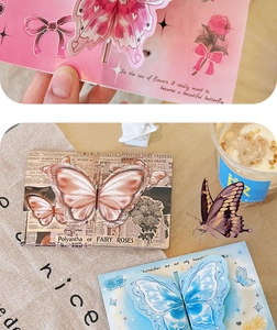 Macro view of vintage 3D butterfly pop-up greeting cards with artistic floral inscriptions