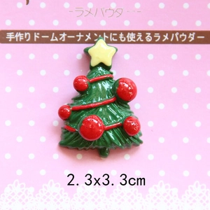 Macro view of Christmas tree resin charm with yellow star and red dots for DIY crafts