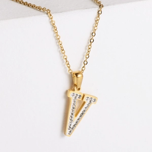 Detail of 18k gold plated V-letter pendant with sparkling crystal rhinestones for women