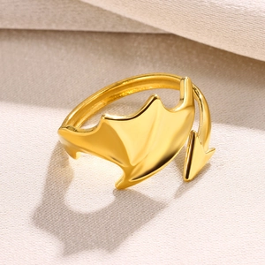 Detailed view of a gold-plated snake ring with devil wing and arrow tip design elements