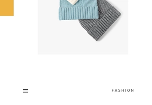 Detail of ribbed knit beanies in blue, white, and grey with thick fold-up brims