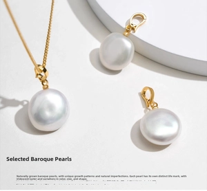 Macro shot of natural baroque pearl pendant with golden clasp on minimalist white stand