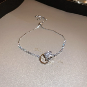 Bracelet tennis vintage argenté avec cercles de zircone et fermoir coulissant ajustable