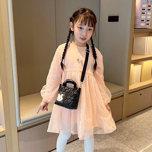 Girl's black quilted crossbody bag with cute white bunny plush pendant and adjustable strap