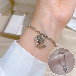 Silver beaded titanium steel bracelet with Fuxi long-life lock pendant on wrist