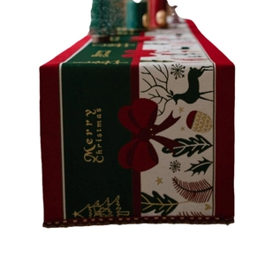 Christmas table runner with reindeer and snowflakes design featuring Merry Christmas text