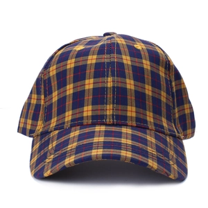 Detail of yellow and blue plaid baseball cap with premium cotton stitching and curved brim