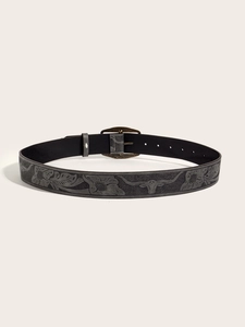 Detail of vintage Y2K leather belt showing embossed bull head and floral patterns