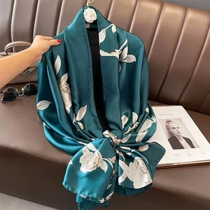 Deep green floral silk scarf with large white flower prints for beach sun protection