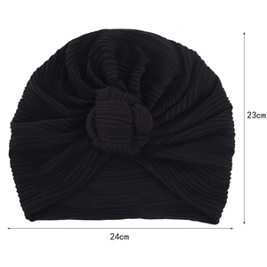 Detailed view of black knitted turban hat with 24cm width and 23cm height dimensions