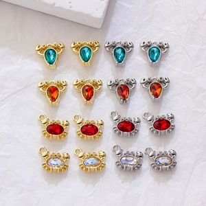 Selection of gold and silver crab and ox head charms with colorful zircon stones