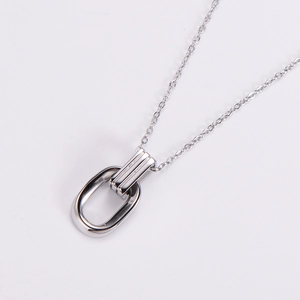 Elegant silver necklace with interlocking oval rings on a delicate metal chain link