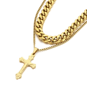 Gold layered necklace with heavy Cuban chain and a classic cross pendant for men