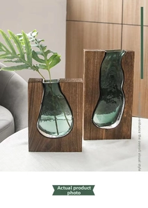 Close-up of Nordic solid wood frame with irregular blue-green glass vase for home decor