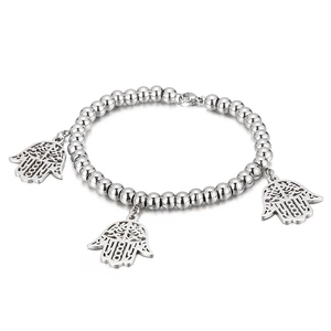 Polished silver beaded bracelet featuring three hollow Hamsa hand charms on white background