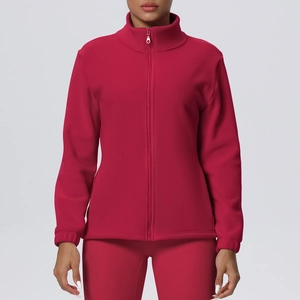 Detail of magenta fleece sports jacket showing high collar and smooth zipper closure