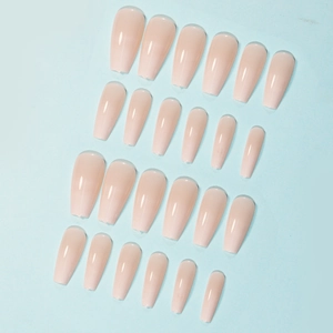 Detail of nude gradient ballet press-on nails in various sizes for manicure styling