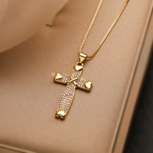 18K gold plated cross necklace with heart shaped ends and cubic zirconia crystals