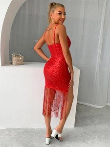 Detail of red sequin dress with long fringes and open back design for summer evening wear