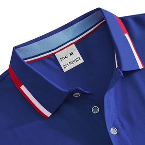 Detail of blue polo shirt neckline showing breathable mesh texture and size M label