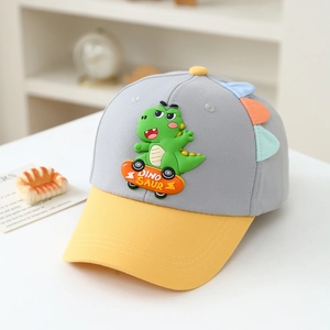 Detail of cartoon dinosaur embroidery on cotton kids baseball cap with yellow visor