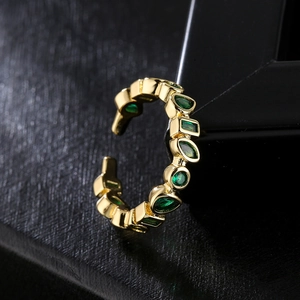 Irregular 18K gold plated ring with emerald green zircon stones in geometric open design