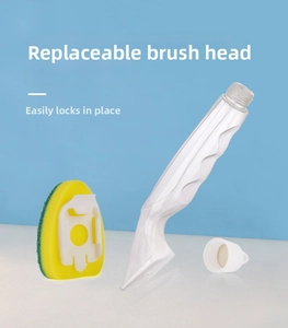 Detail of ergonomic kitchen brush with replaceable yellow sponge head and long handle