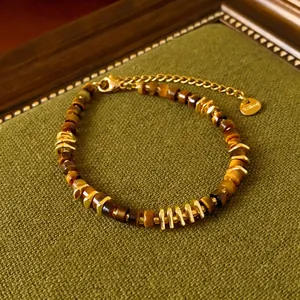 Tiger eye stone bracelet with irregular gold beads and lobster clasp in retro style