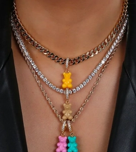Multi-layered necklace with colorful resin gummy bears and zircon-paved connectors on gold chains
