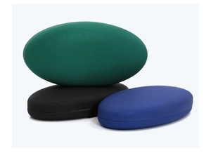 Macro detail of oval PU leather jewelry storage boxes in green, black and blue colors